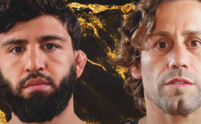 Two men with serious expressions stand side by side against a dark, lava‑like gold background.