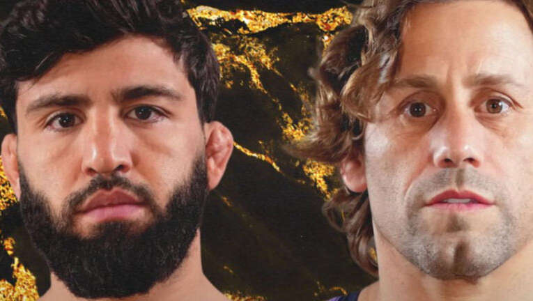 Two men with serious expressions stand side by side against a dark, lava‑like gold background.