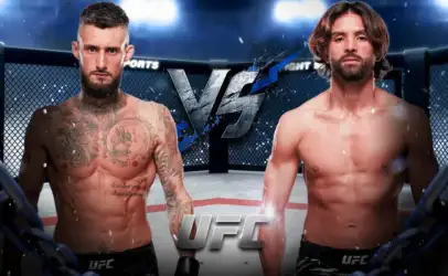 Two shirtless UFC fighters stand in the arena, facing off with a large VS graphic between them inside the cage.