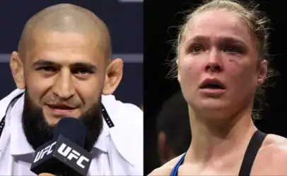 Split-screen of two UFC fighters: left is a bearded man with a shaved head speaking into a mic at a press event; right is a female fighter with a bruised face in athletic gear.