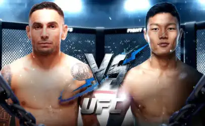 Two shirtless MMA fighters face off inside a cage with a bold VS graphic between them, UFC branding visible in the center.