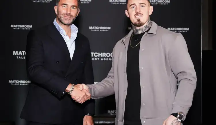 Two men shake hands at a media event in front of a black backdrop that reads MATCHROOM.