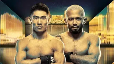 Two shirtless male mixed martial artists stand with arms crossed, in front of a dramatic cityscape background, suggesting an upcoming UFC fight poster.