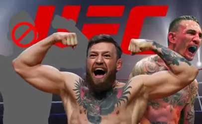 Bearded fighter in the foreground flexes his biceps and cheers inside a boxing ring, with a bold red UFC logo in the background and a tattooed teammate beside him.