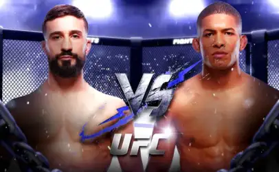 Two shirtless male mixed martial artists stand in a UFC cage facing each other with a large VS graphic between them.
