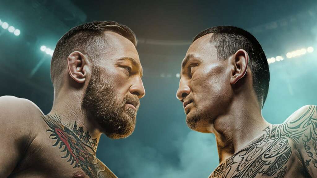 0h1to1h_conor-mcgregor-vs-max-holloway-ufc-329_625x300_02_July_26 - AfroCombat Two tattooed men face off shirtless in a stadium, intense stare-down under bright arena lights.