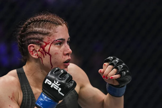 b8206edea95075bb7edf44f43d2fc234 - AfroCombat Female MMA fighter with braided hair, glove up, blood streaming down her temple as she stares forward in the cage.