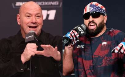 Dana White (left) and a UFC fighter wearing an American-flag bandana speak into microphones at a UFC press conference.