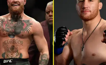 Split image of two male MMA fighters: left, heavily tattooed with a big chest piece and blue gloves, smiling in a crowd; right, shirtless with a red beard, black necklace, and tattoos, posing in a neutral studio backdrop.