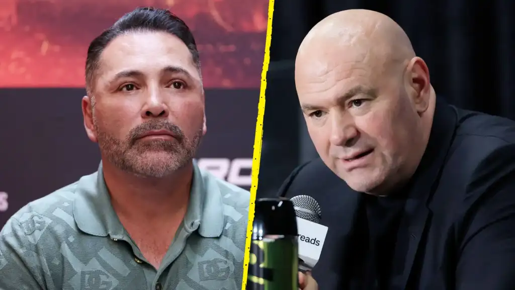 Split-screen of two men in a debate: left is a bearded man in a light green camo polo, right is a bald man in black speaking into a microphone, separated by a yellow divider.